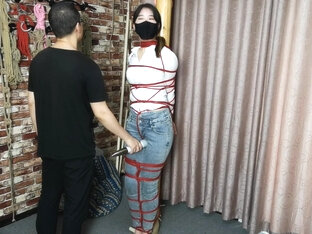 Asian Girl Post Tied With Red Rope