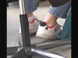 candid feet in white ankle socks and sneakers