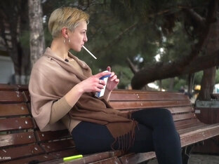 Short Cut Hair Blonde Girl Is Smoking All White 120mm Cigarettes
